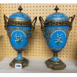 PAIR OF 19TH CENTURY GILT METAL OVOID ENAMEL CASSOLETTES WITH OVER PAINTED DECORATION AND SATYR