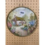 NEEDLEPOINT ROUNDEL OF THE COUNTRY COTTAGE GARDEN IN GILT FRAME