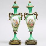 Pair of 'Sèvres' Apple Green Ground Gilt Metal Mounted Mantle Urns, 20th century, height 14.3 in —