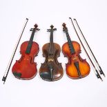 Three Continental Violins, early to mid 20th century, each body length 14 in — 35.6 cm (3 Pieces)