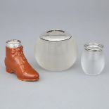 Two Silver Mounted Threaded Glass Match Strikers and a Porcelain Boot, early 20th century, largest h