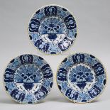 Three De Drie Klokken Delft Blue Painted 'Peacock' Pattern Plates, 18th century, diameter 9 in — 22.