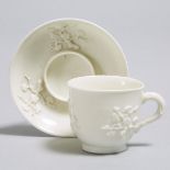 Saint-Cloud Moulded and White Glazed Prunus Trembleuse Cup and Saucer, c.1725, saucer diameter 5 in