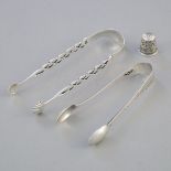 Two George III and Victorian Silver Sugar Tongs, London, c.1775/1893, and a Thimble, Chester, 1896,