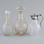 Two Anglo-Irish Cut Glass Decanters and a Silver Plate Mounted Claret Jug, 19th century, largest hei