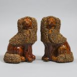 Pair of American 'Rockingham' Treacle Glazed Figures of Seated Spaniels, 19th century, height 9.6 in