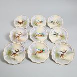 Nine Limoges Game Plates, early 20th century, diameter 9.4 in — 24 cm (9 Pieces)