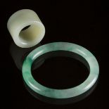 A White Jade Archer's Ring, Together With a Jadeite Bangle, 白玉雕扳指 翡翠镯一组两件, bangle diameter 3 in — 7.