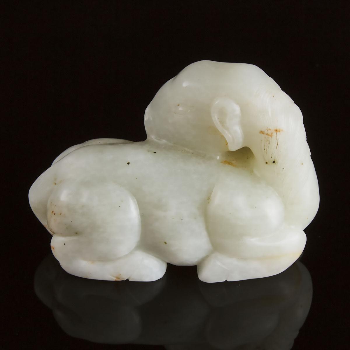 A Mottled White Jade Carving of a Recumbent Ram, Ming Dynasty, 17th Century, 明 十七世纪 青白玉卧羊, 2 in — 5. - Image 2 of 4