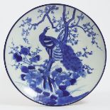 An Arita Blue and White 'Peacock' Charger, Edo Period, 18th/19th Century, diameter 18.2 in — 46.3 cm