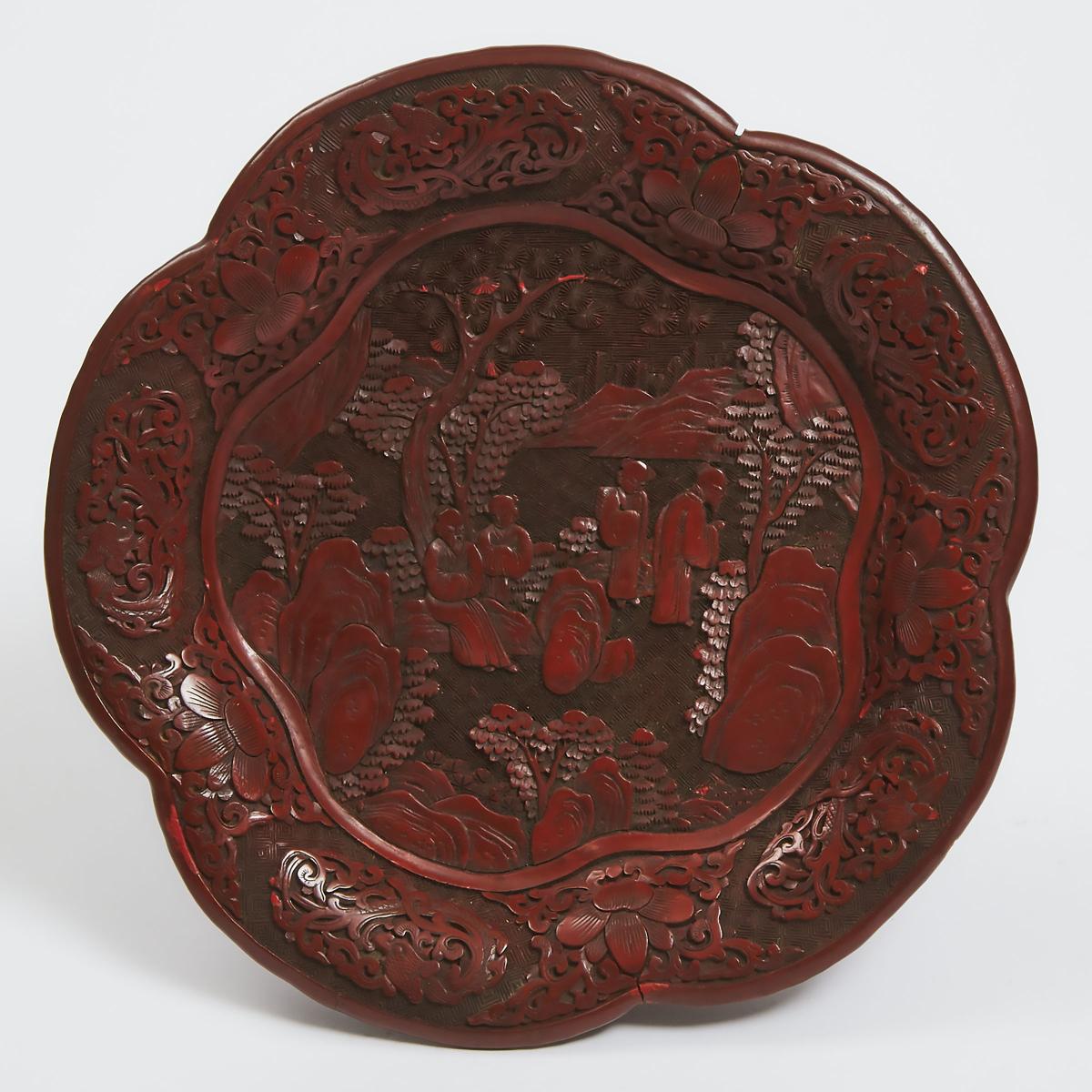 A Carved Cinnabar Lacquer Lobed Dish, Qing Dynasty, 19th Century, 晚清 十九世纪 剔红松下高仕图花口盘, diameter 10.1