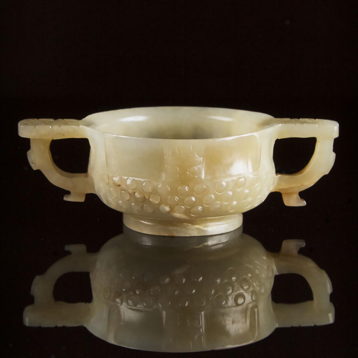 A Chinese Archaistic Celadon White Jade Libation Cup, Ming Dynasty, 17th Century, 明 青白玉雕乳钉兽面纹杯, 1.4