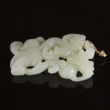A Carved White Jade Archaistic 'Dragon' Pendant, 白玉镂雕螭龙赶珠纹佩, length 3.4 in — 8.7 cm