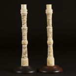 A Pair of Japanese Carved Bone 'Figural' Candlesticks, Meiji Period, Late 19th Century, overall heig