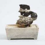 A Chinese Lingbi Scholar's Rock in a Marble Jardinière, 灵璧赏石, overall with jardinière 13.8 x 13 x 8.