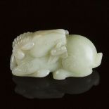 A Pale Celadon Jade Carving of a Ram, 青玉雕卧羊, length 3.3 in — 8.3 cm