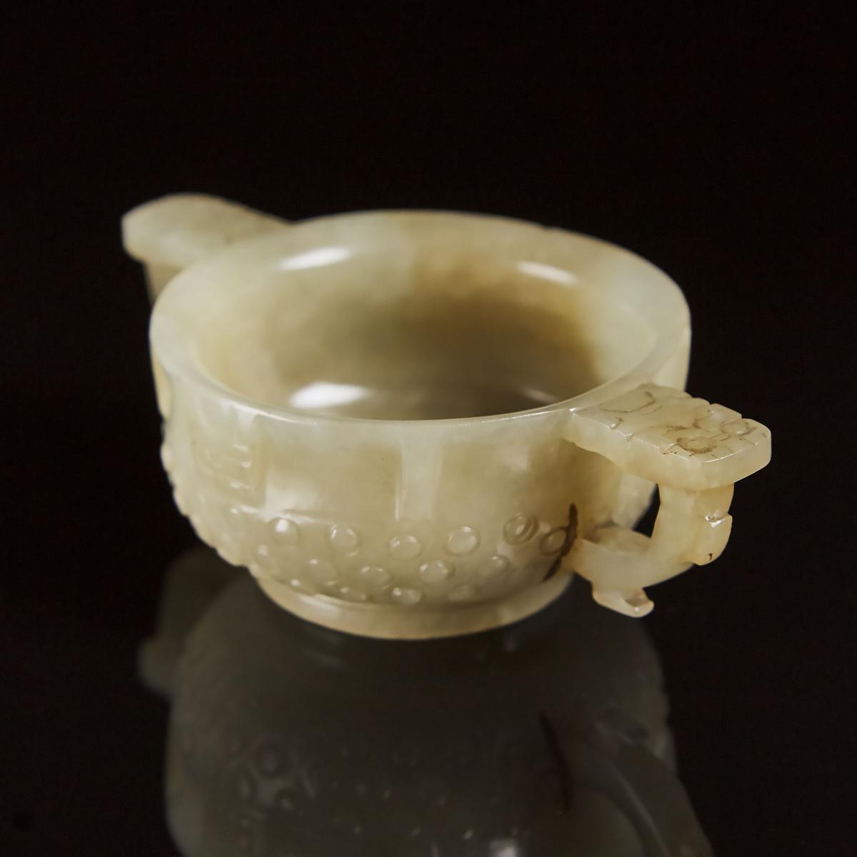 A Chinese Archaistic Celadon White Jade Libation Cup, Ming Dynasty, 17th Century, 明 青白玉雕乳钉兽面纹杯, 1.4 - Image 6 of 6