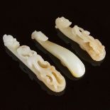 A Group of Three White and Pale Russet Jade Belt Hooks, 白玉雕螭龙带钩一组三件, length 3.7 in — 9.4 cm (3 Piece