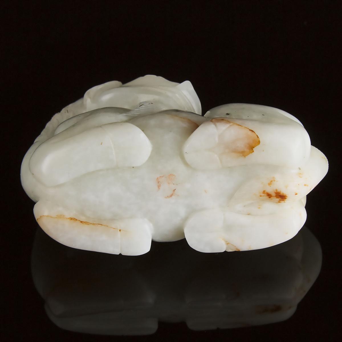 A Mottled White Jade Carving of a Recumbent Ram, Ming Dynasty, 17th Century, 明 十七世纪 青白玉卧羊, 2 in — 5. - Image 4 of 4