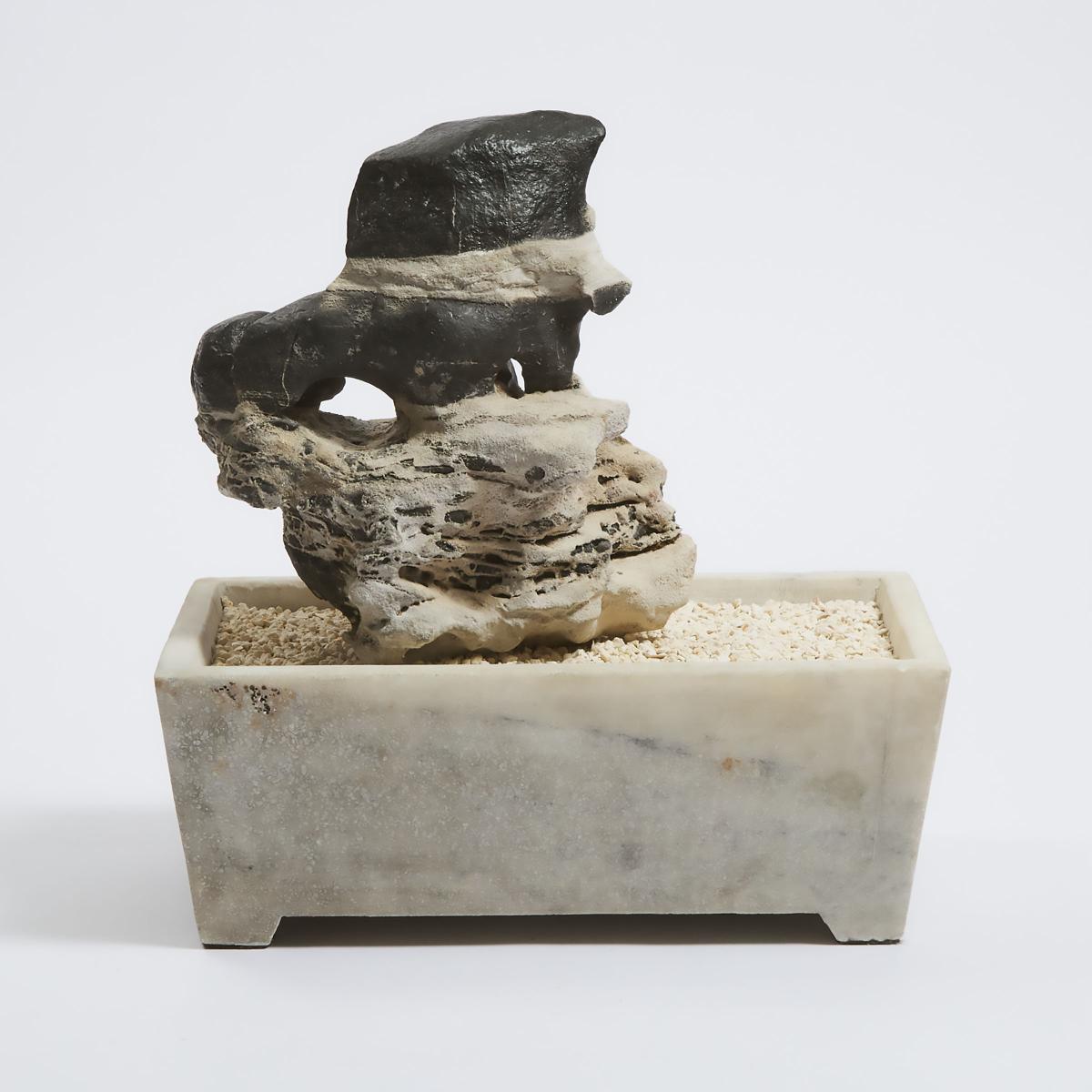 A Chinese Lingbi Scholar's Rock in a Marble Jardinière, 灵璧赏石, overall with jardinière 13.8 x 13 x 8. - Image 2 of 2