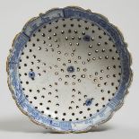 French Blue Painted Faience Strainer, 19th century, diameter 8 in — 20.2 cm
