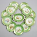 Eleven Coalport Apple Green Ground Topographical Dessert Plates and a Serving Dish, Percy Simpson, e