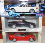 2 UT Models 1:18 scale BMW E30's. M£ Cabriolet in metallic dark grey with red interior and a 3
