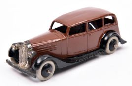 Dinky Toys 30d Vauxhall. An example in dark brown with black open chassis and smooth wheels and