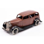 Dinky Toys 30d Vauxhall. An example in dark brown with black open chassis and smooth wheels and