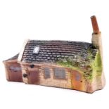 A Spot-On 'Cotswold Village' series building, 'The Smithy Village Forge'. Boxed, some age wear,