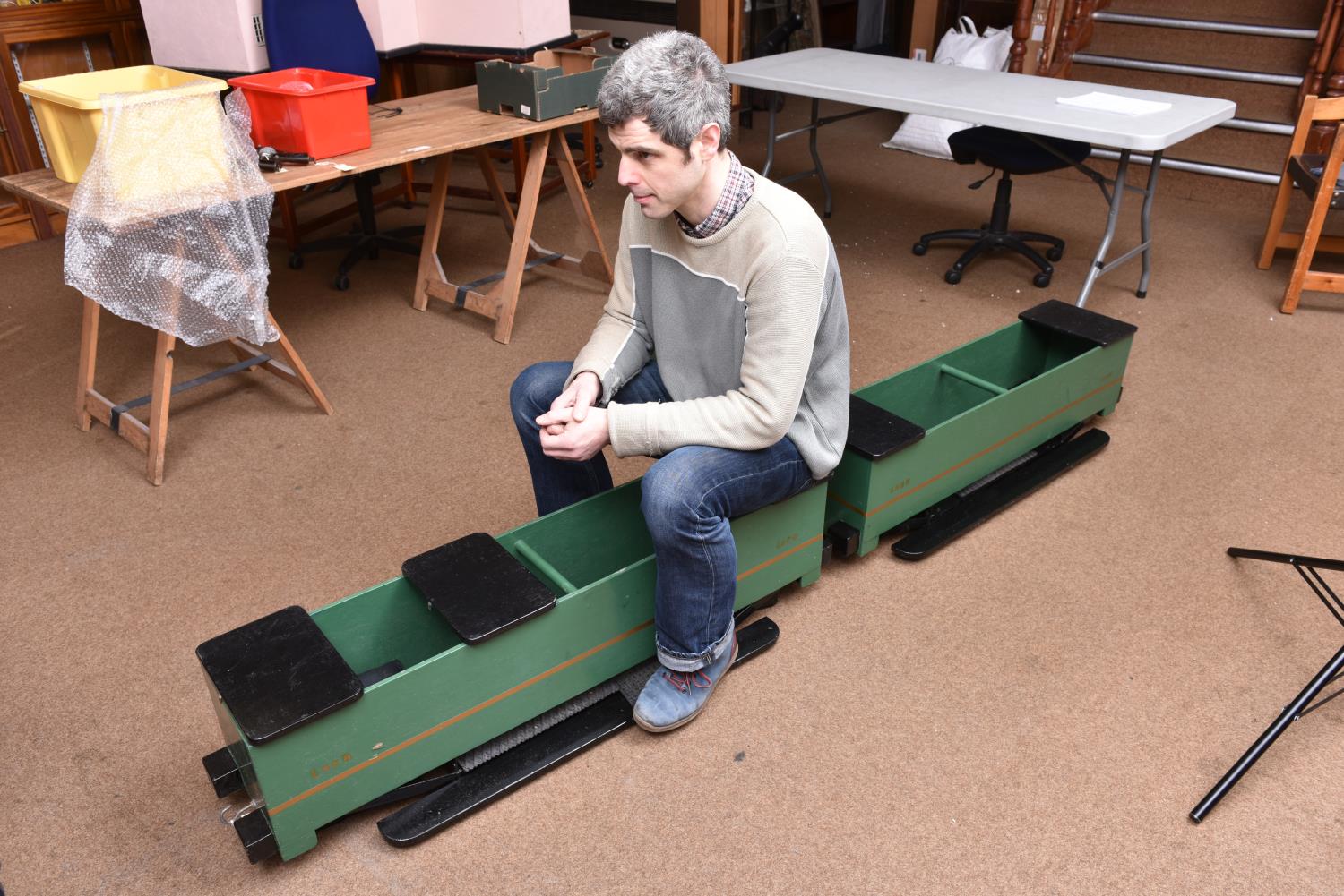 A 5 inch gauge articulated railway carriage for ground level running. Well constructed wooden bodies