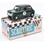 A Tri-ang Scalextric Austin Mini Cooper (C76). Example in green with driver, RN7. Boxed with