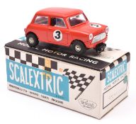 A Tri-ang Scalextric Austin Mini Cooper (C76). Example in red with driver, RN3. Boxed with