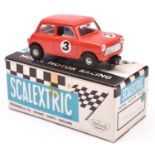 A Tri-ang Scalextric Austin Mini Cooper (C76). Example in red with driver, RN3. Boxed with