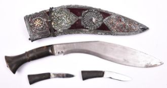 A Gurkha kukri, blade 10", with plain horn hilt, in its purple velvet covered sheath with large red,