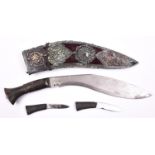 A Gurkha kukri, blade 10", with plain horn hilt, in its purple velvet covered sheath with large red,