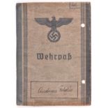 A Third Reich Wehrpass, to Andreas Geldus, who joined the Waffen SS in 1942, being promoted to