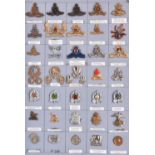 35 South African cap badges, mostly modern, a few earlier, including Natal Field Artillery bronze