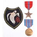 USA WWII bronze star and African campaign medals, EF and NVF; and an embroidered patch of the “Ghost