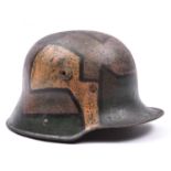A German M16 steel helmet, with dazzle painted camouflage and reproduction padded lining.