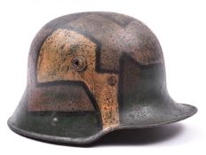 A German M16 steel helmet, with dazzle painted camouflage and reproduction padded lining.