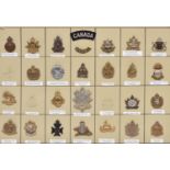 24 WWII and later Canadian cap badges, mostly Infantry, also a brass “CANADA” and similar cloth