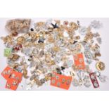 Over 2lbs weight of assorted anodised cap and collar badges, mostly British, and approximately 120