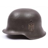 A Third Reich M42 single decal steel helmet, the skull with rough dark grey finish and eagle