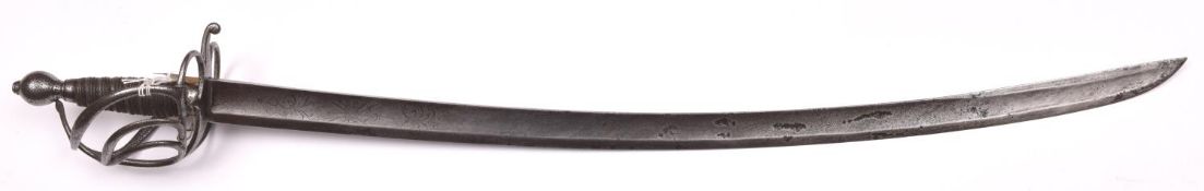 A European (German?) cavalry officer’s sword, c 1760-1780, broad slightly curved blade 34”