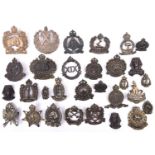 22 Australian cast brass cap badges, mostly pre WWII numbered infantry with bronzed or blackened