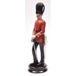 A fine Michael Sutty painted porcelain figure of an officer of the Grenadier Guards (Model N0.