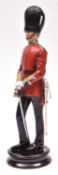 A fine Michael Sutty painted porcelain figure of an officer of the Grenadier Guards (Model N0.