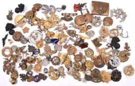 Over 2lbs weight of mostly military badges, British and overseas, including caps, collars, lapels,