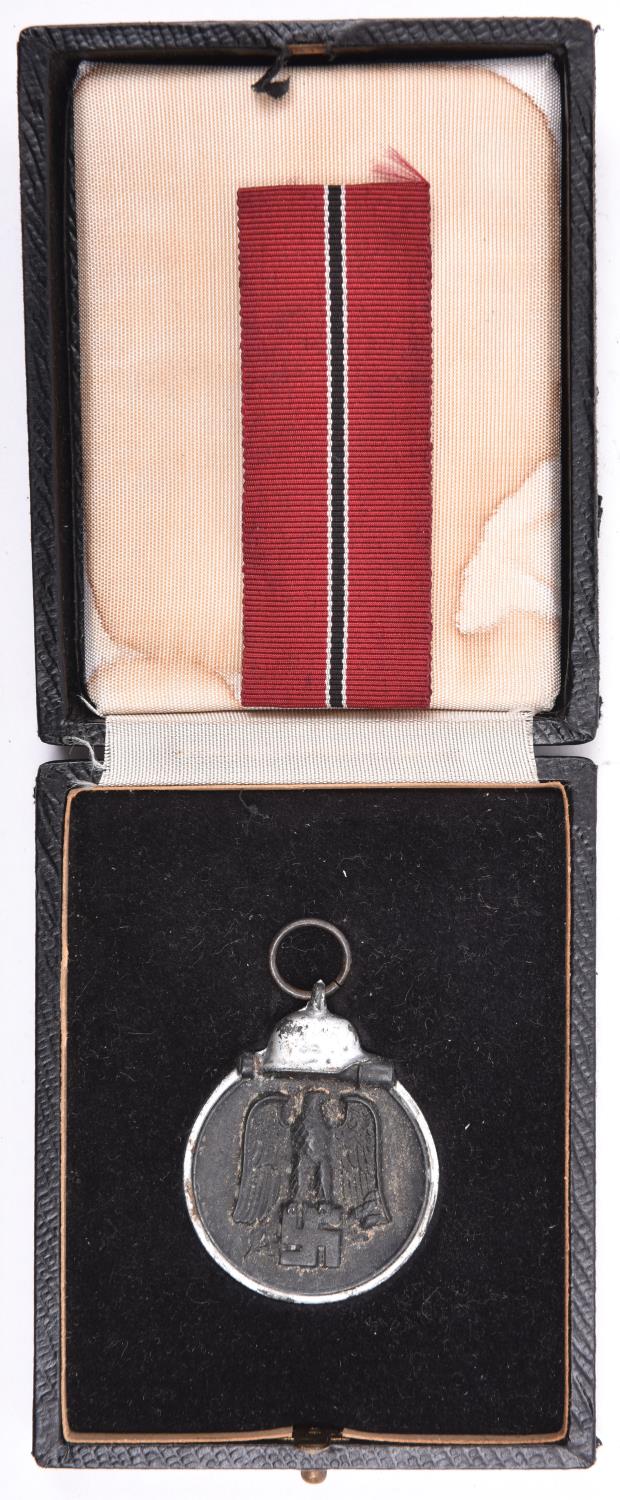 A Third Reich Eastern Front medal, GC, in a box with a length of ribbon. £30-40